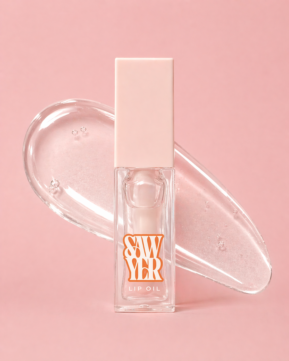 Lip oil with clear cap on a pink background