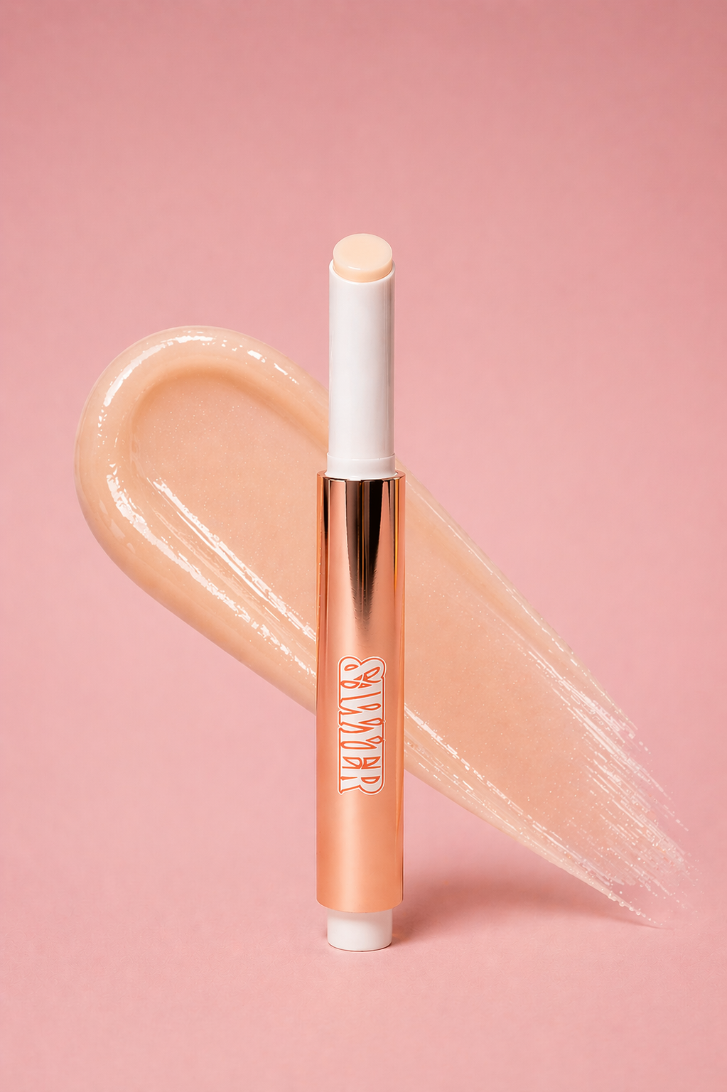 Lip gloss with a visible brand name on a pink background