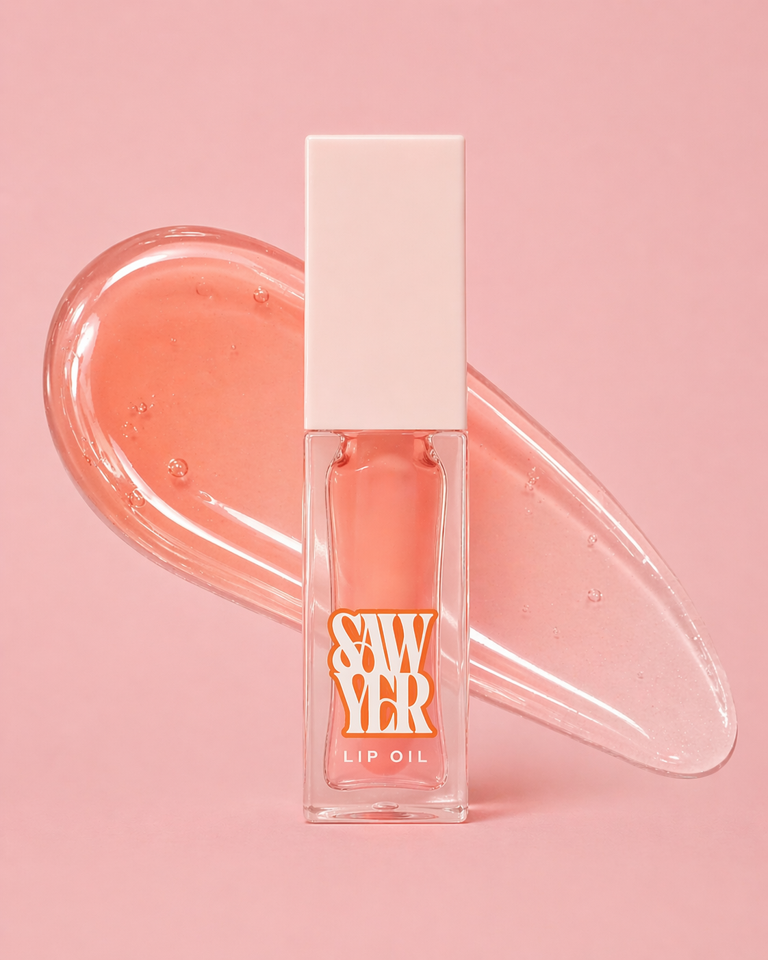 Pink lip oil with packaging on a pink background