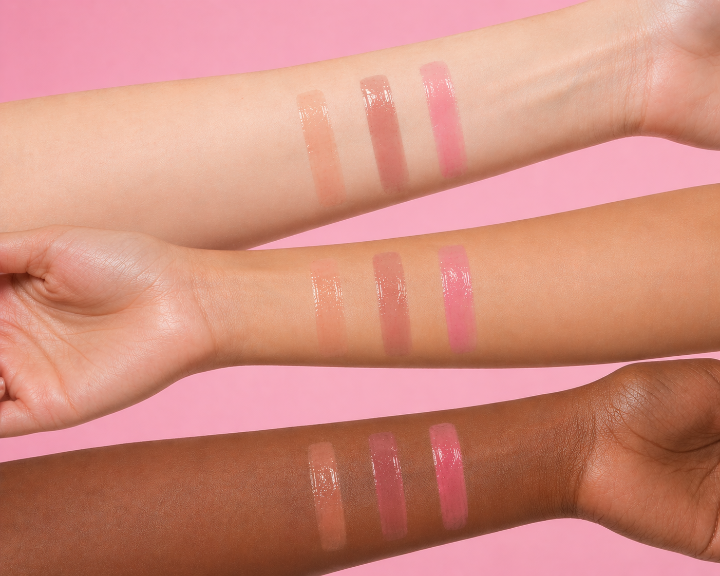 Lipstick swatches on three different skin tones against a pink background