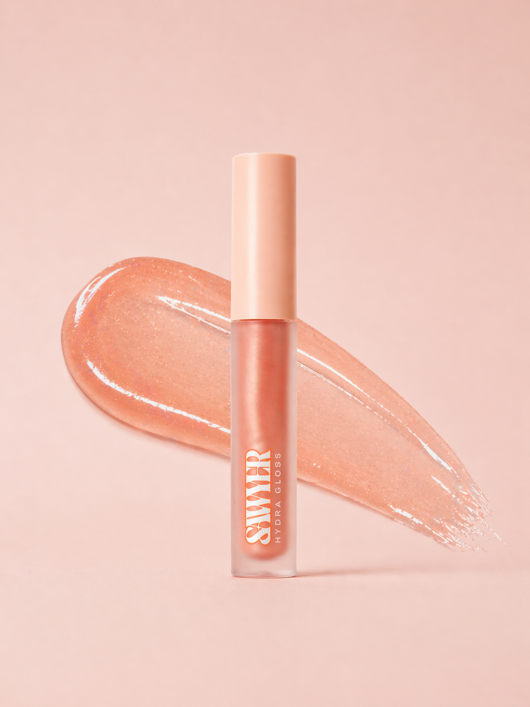 Lip gloss with a swatch on a pink background